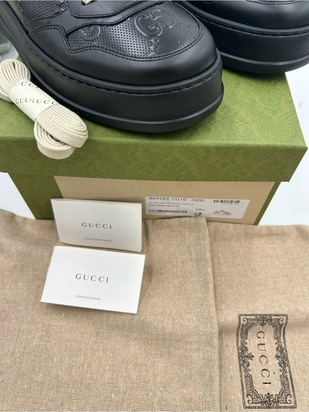 Men's Gucci, GG embossed leather sneakers size 10.5 made in Italy